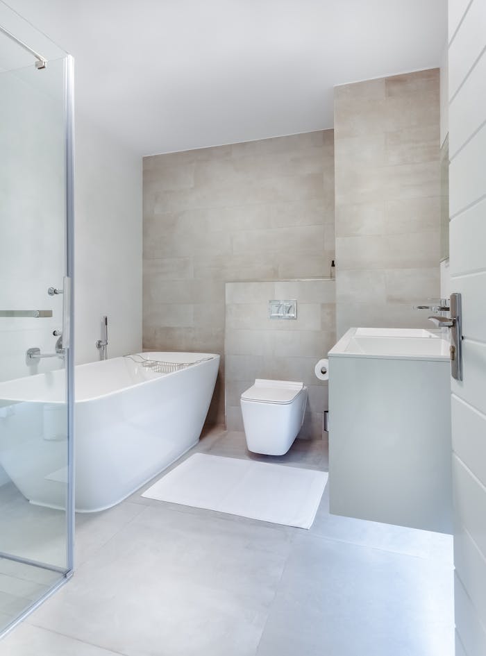 bathroom-interior-1457847 Elegant minimalistic bathroom featuring bathtub and sleek fixtures.
